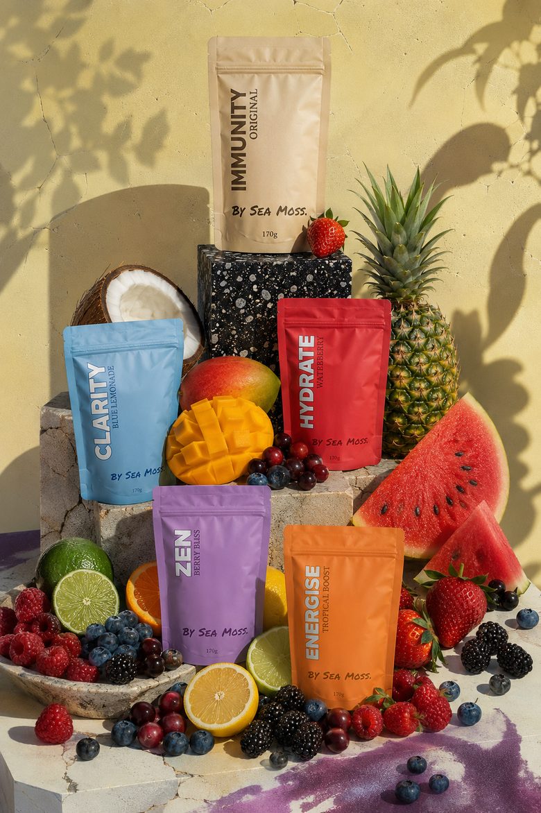 By Sea Moss. pouches stacked with fresh tropical fruit